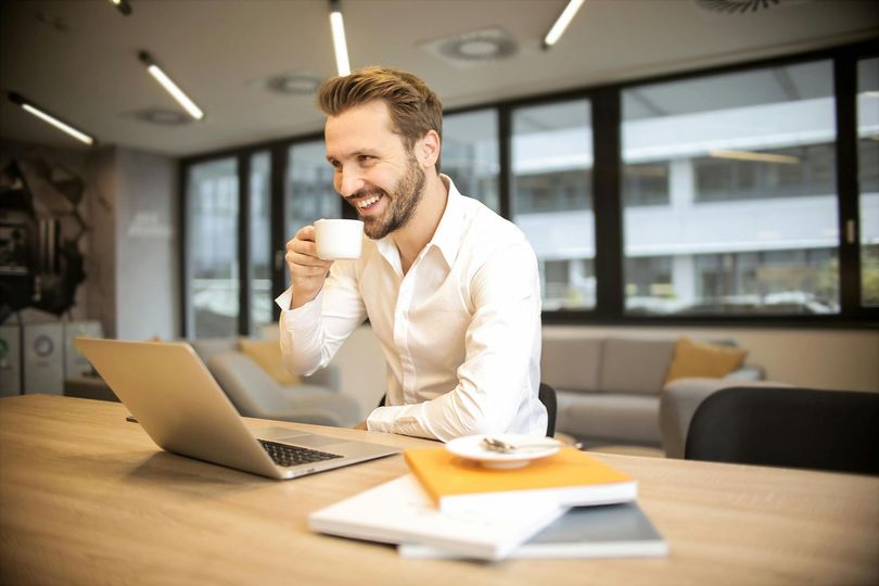 man drinking coffee ready to perform search engine optimization