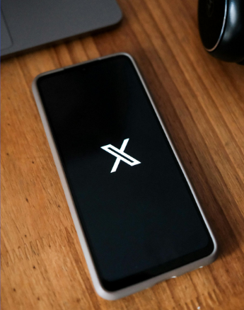 X app logo on mobile phone