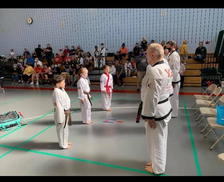 An aerial view of a city skyline at sunset.