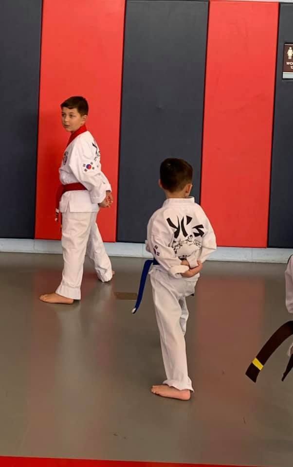 An aerial view of a city skyline at sunset.