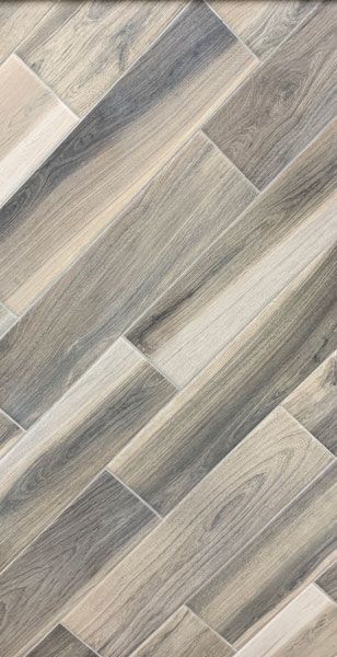 A close up of a wooden floor with a diagonal pattern.