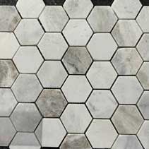 A close up of a hexagon tile pattern on a wall.