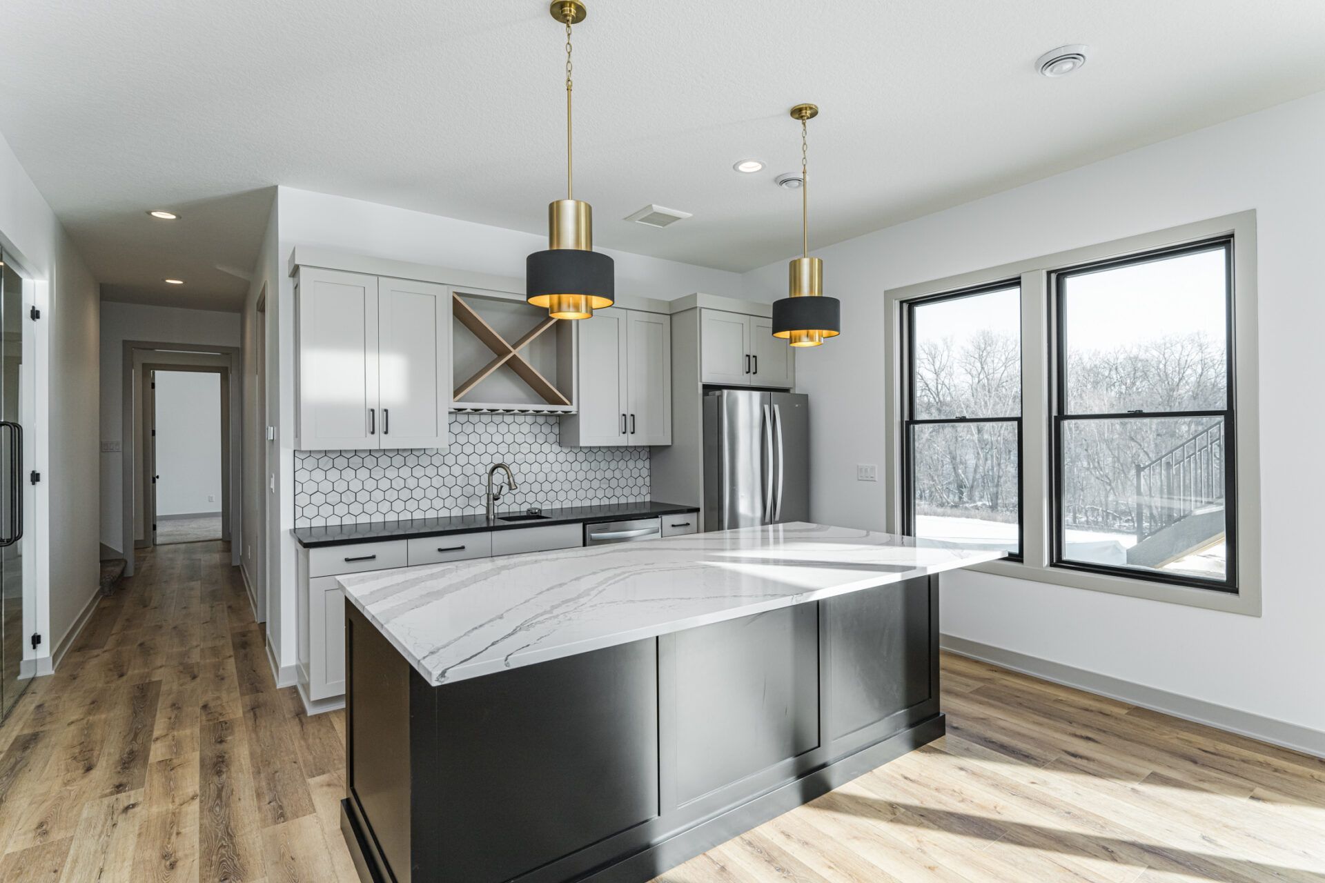 There is a large island in the middle of the kitchen.