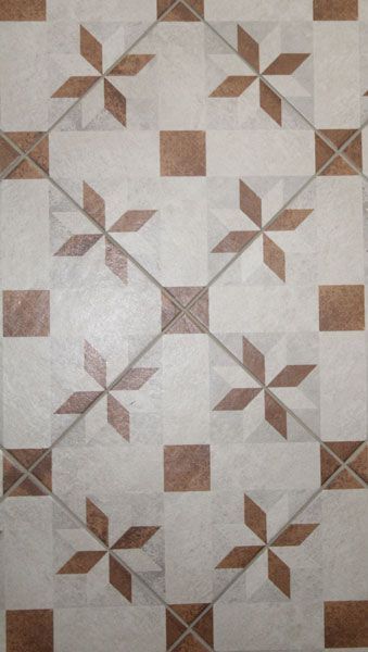 A white tile with brown squares and stars on it