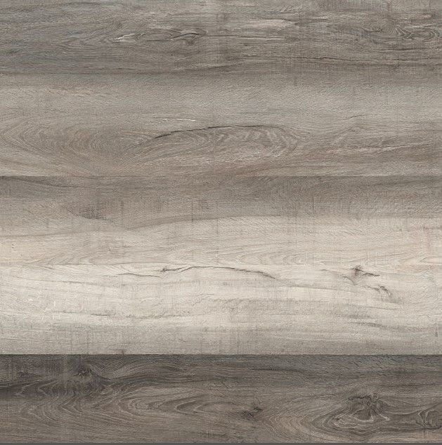 A close up of a wooden floor with a gray and white grain.