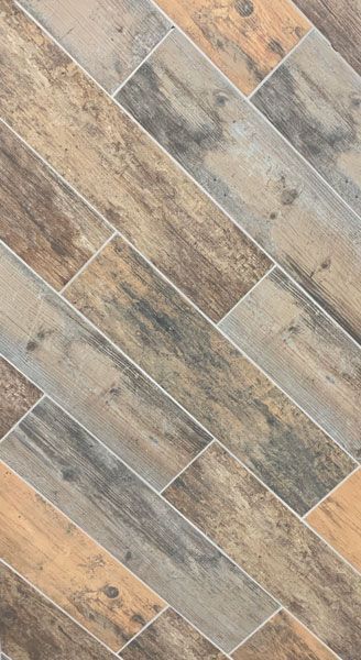 A close up of a tile floor that looks like wood.