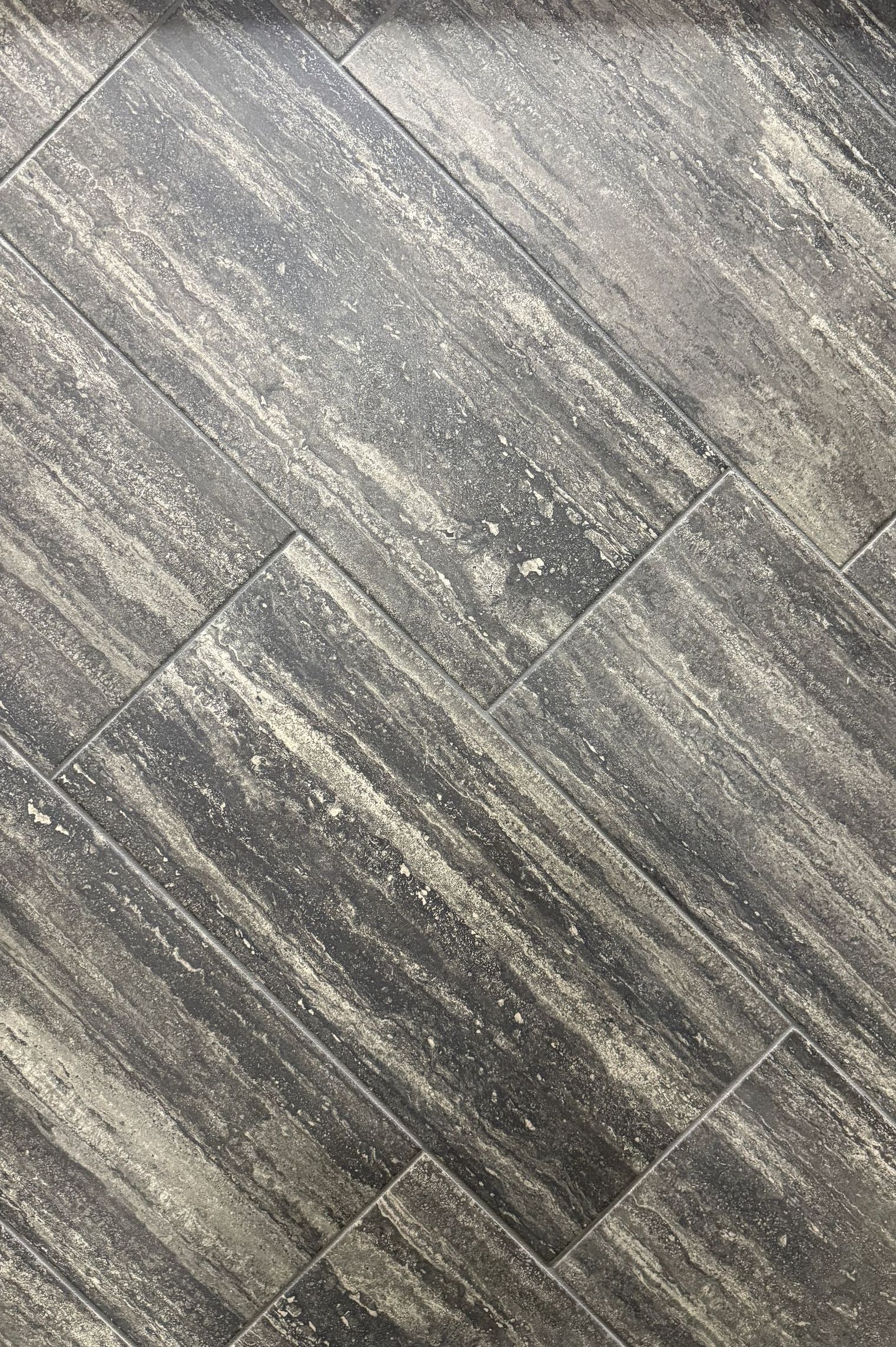 A close up of a black and white tile floor.