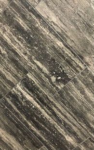 A close up of a black and white tile floor.
