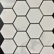 A close up of a white hexagon tile on a black background.