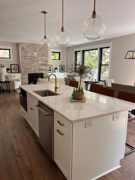 A kitchen with a large island and a sink