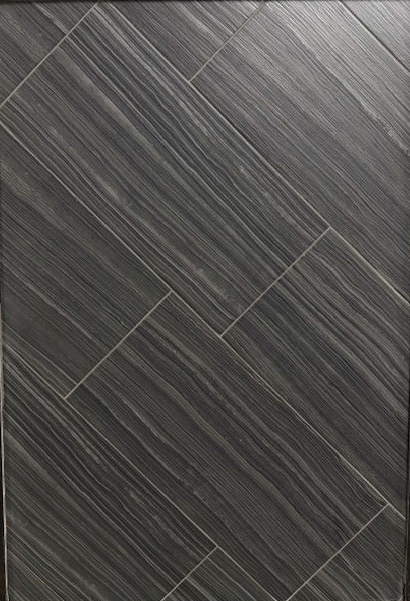 A close up of a gray tile floor with a diagonal pattern.