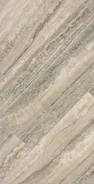 A close up of a tile floor that looks like wood.
