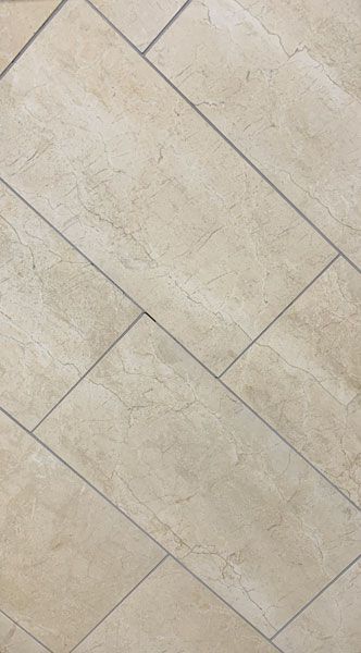 A close up of a tiled floor with a diagonal pattern.