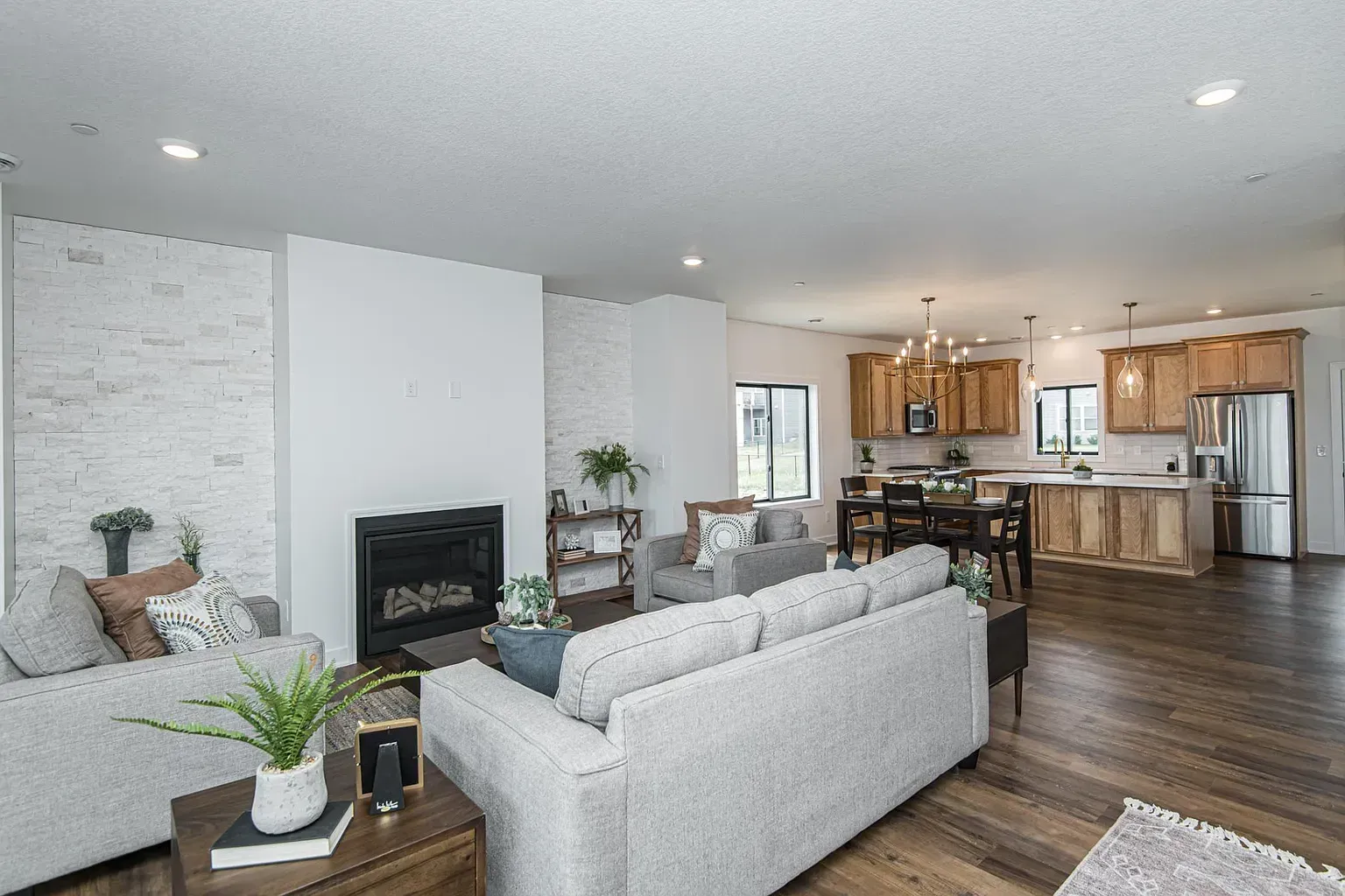 A living room filled with furniture and a fireplace.