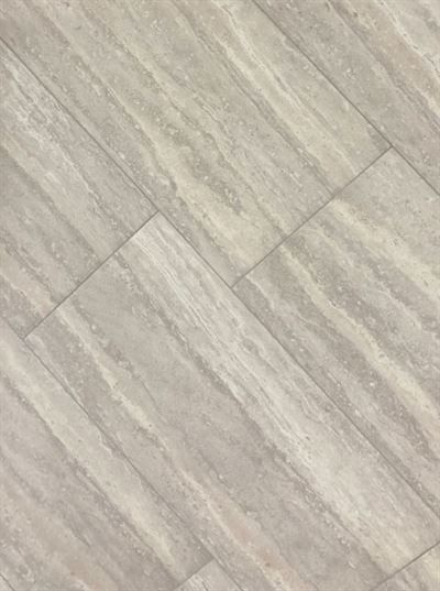 A close up of a tile floor that looks like wood.