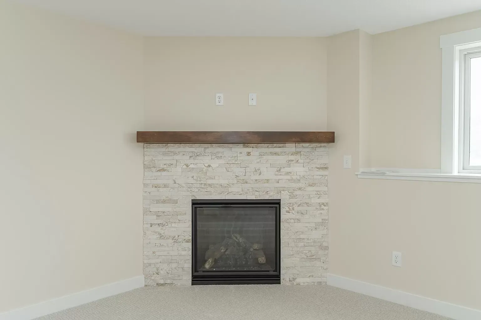 There is a fireplace in the corner of the room.