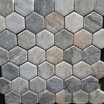 A close up of a hexagon tile pattern on a black surface.