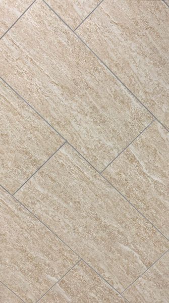 A close up of a beige tile floor with a diagonal pattern.