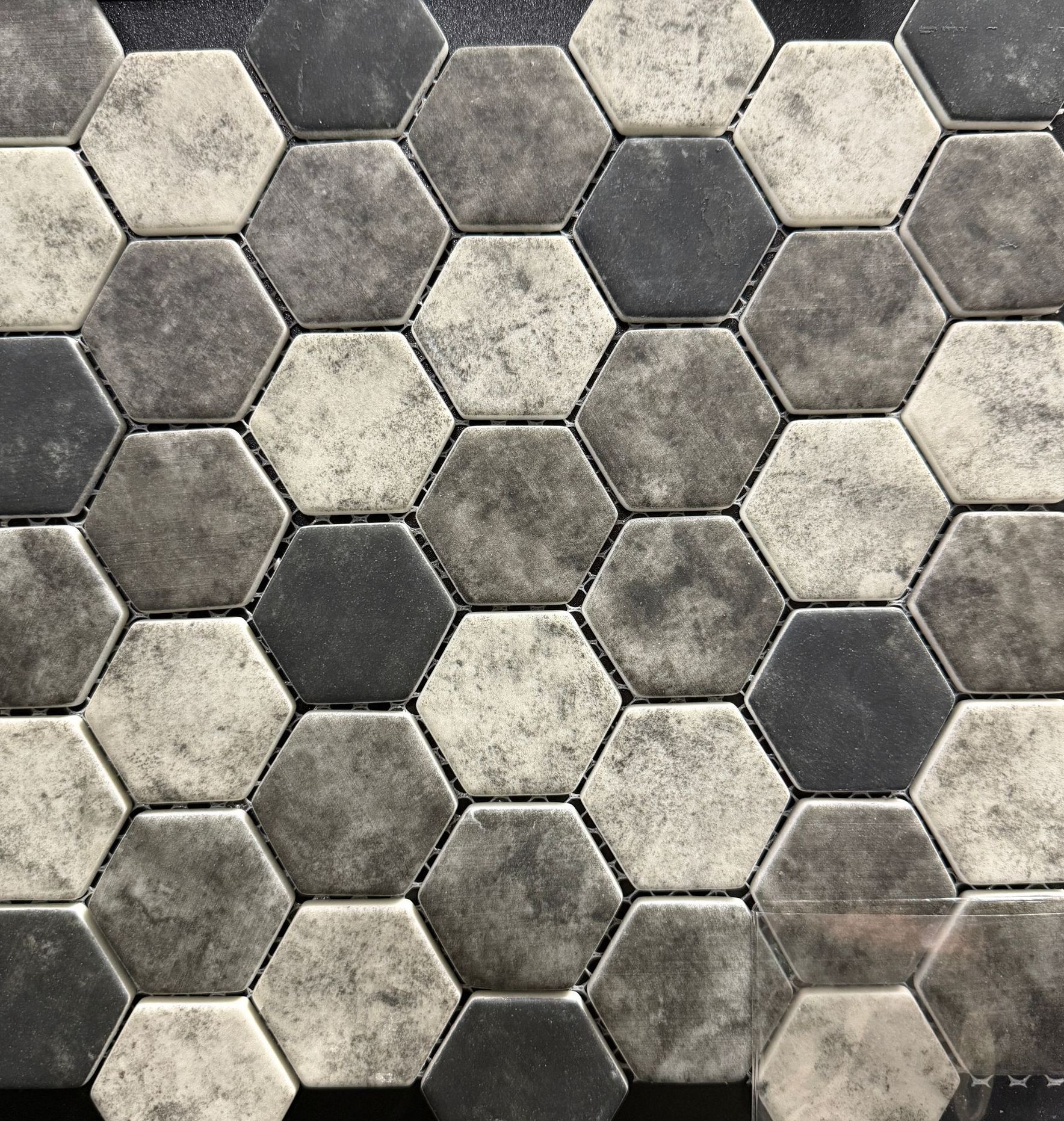 A close up of a black and white hexagon tile