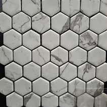 A close up of a white marble hexagon mosaic tile.