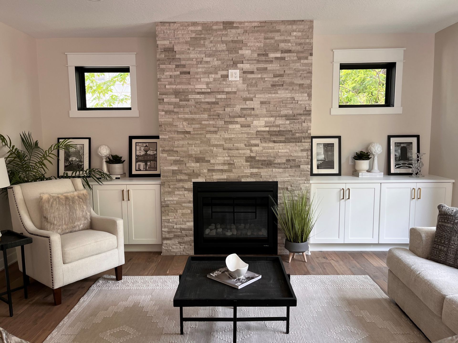 There is a fireplace in the middle of the living room.