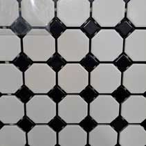 A close up of a black and white tile floor.