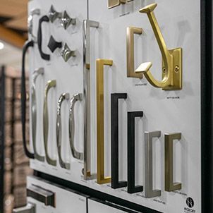 A display of different types of door handles in a store.