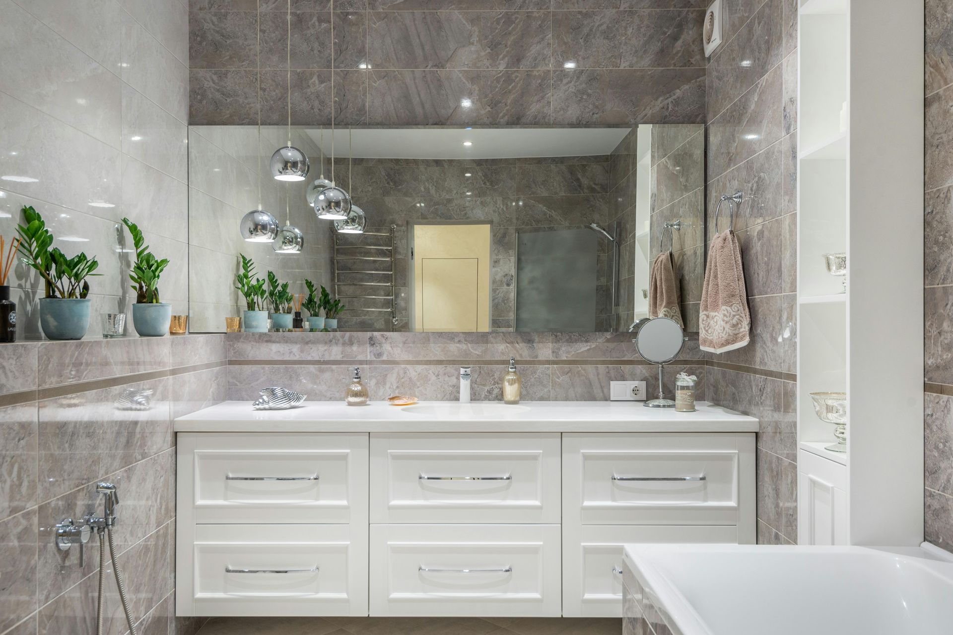 A bathroom vanity with two sinks and a mirror.