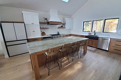There is a large island in the middle of the kitchen.