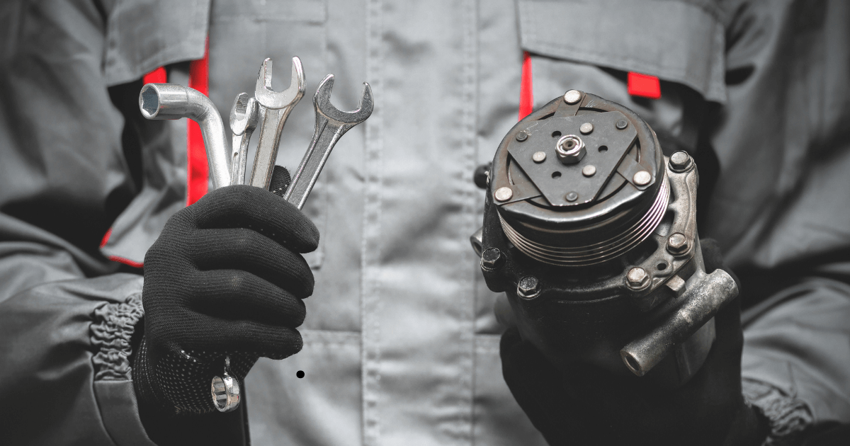 a mechanic holding a wrench