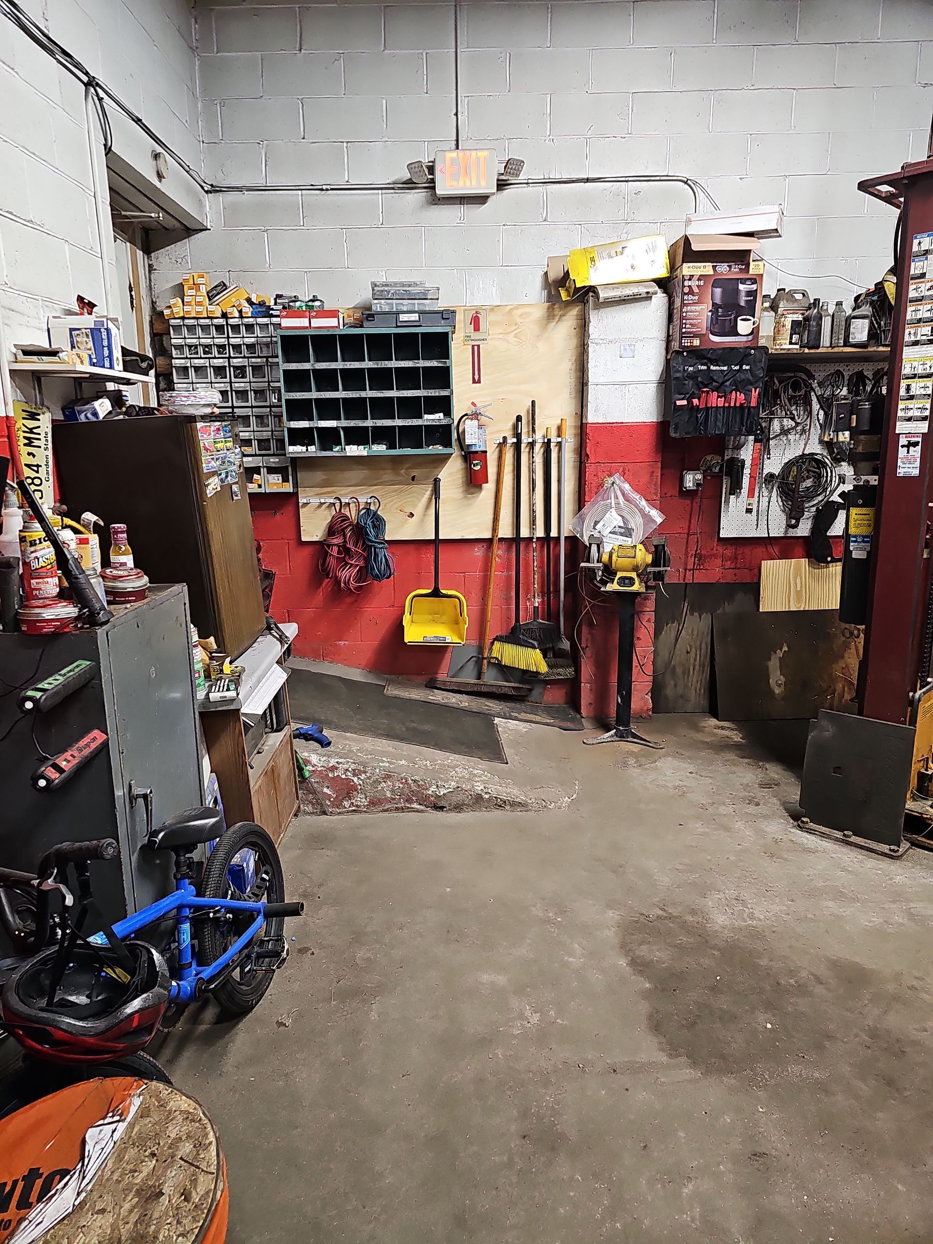 A garage filled with lots of tools and a motorcycle