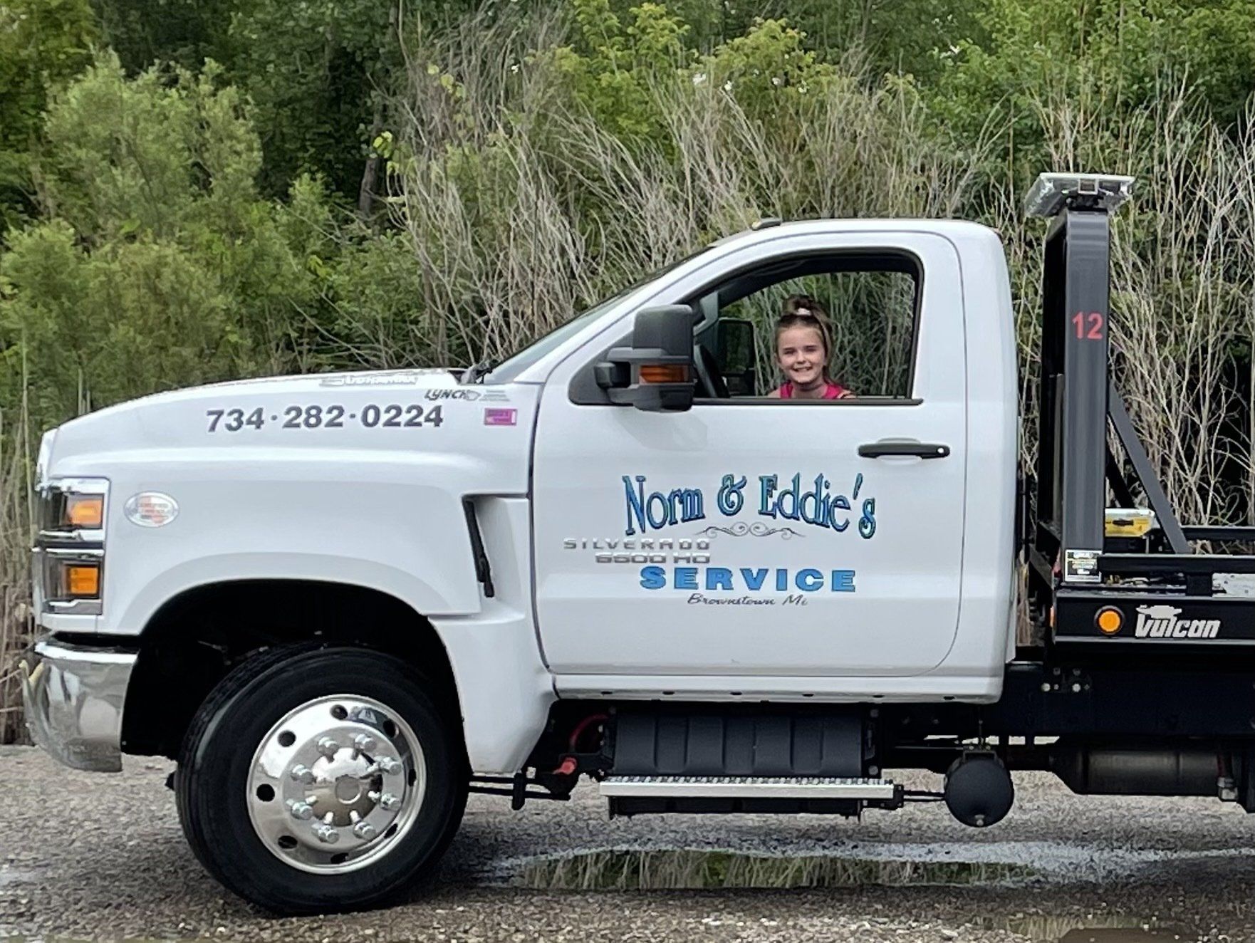 Kid Smiling Inside the Truck — Brownstown, MI — Norm And Eddie's Friendly Service