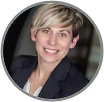 A woman in a suit is smiling in a circle.