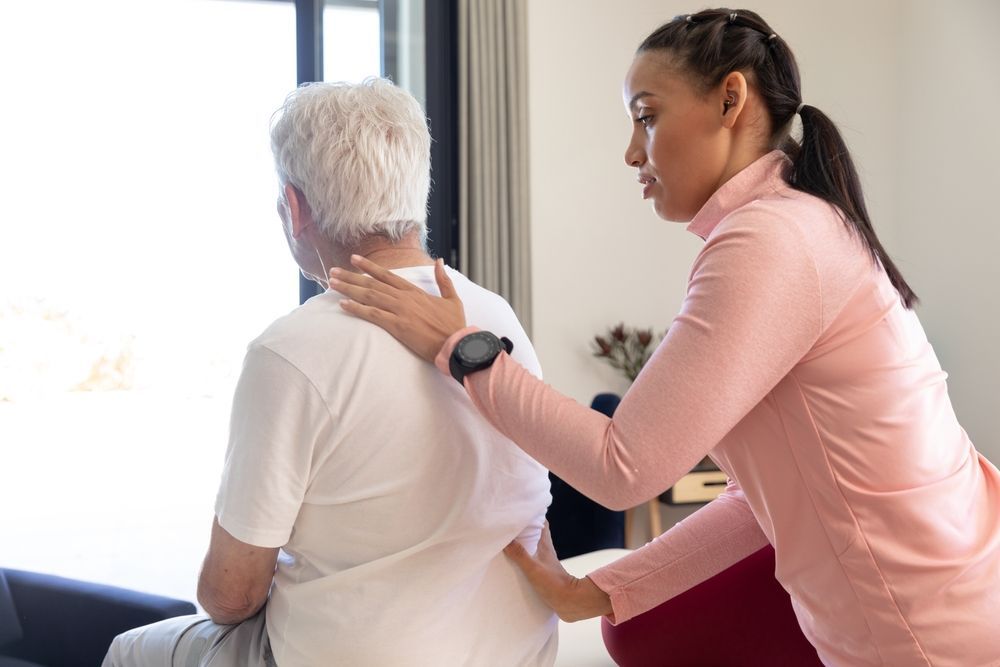 A Healthcare Professional in a Pink Long-sleeved Shirt — Forerunner Physio In Taree, NSW