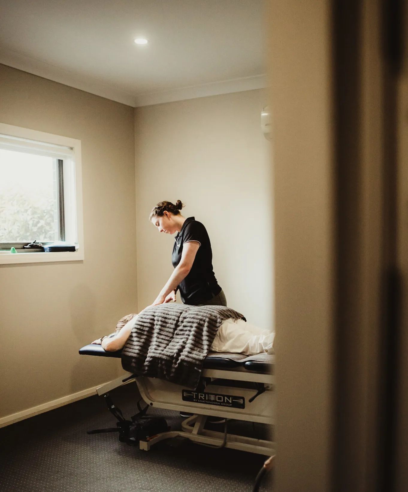 A Person Receiving Treatment on a Massage Table — Forerunner Physio In Taree, NSW