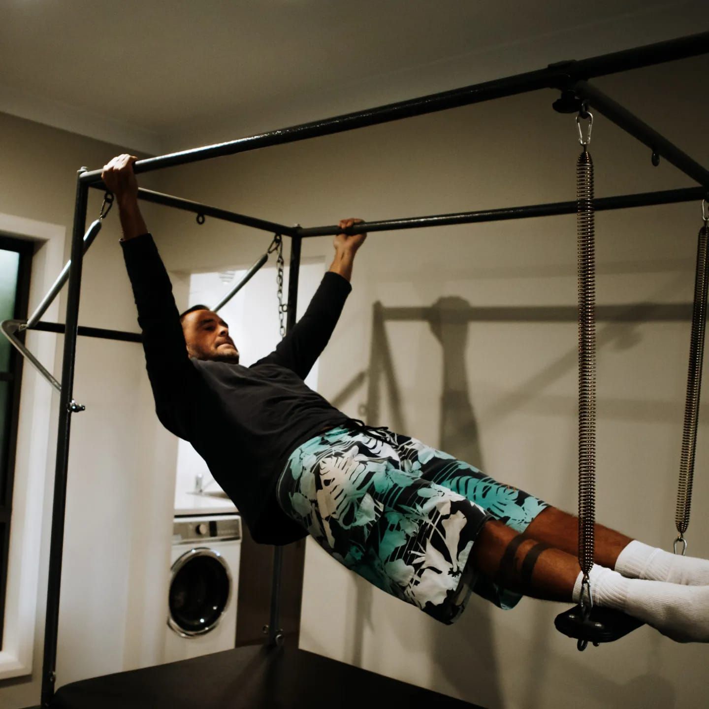 Man Doing an Inverted Row on a Pull-up Bar — Forerunner Physio In Taree, NSW