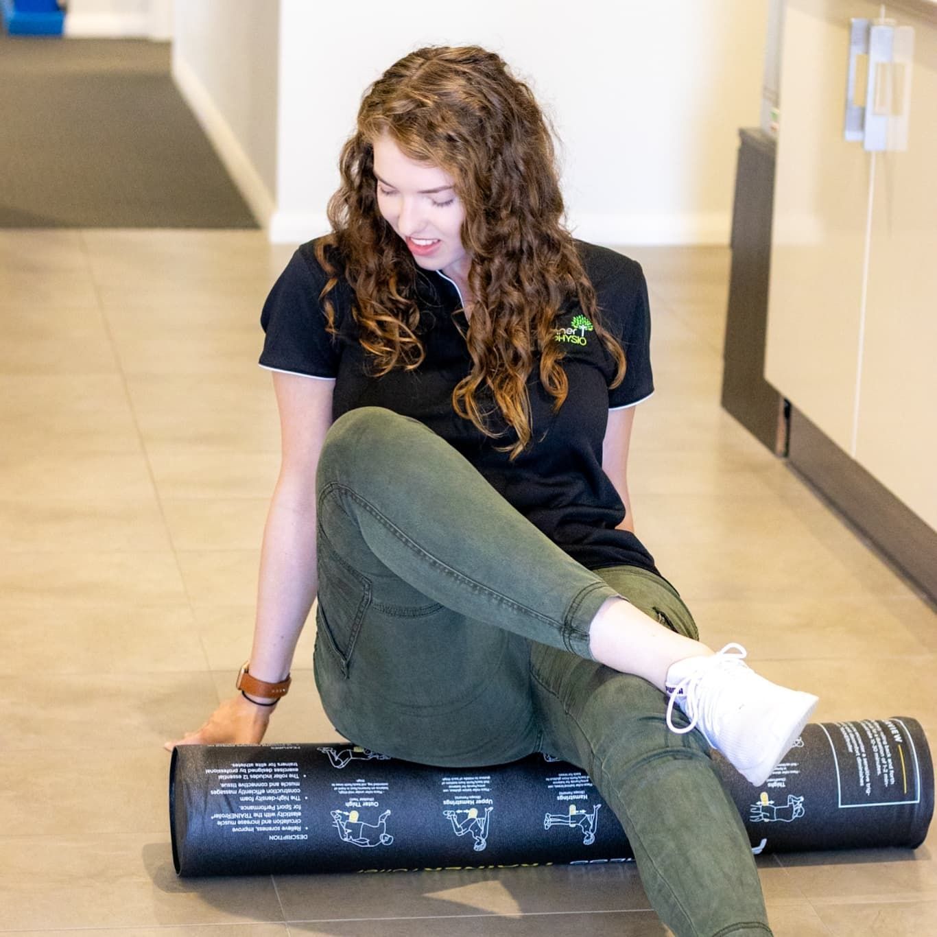 Woman Sitting on a Foam Roller — Forerunner Physio In Taree, NSW