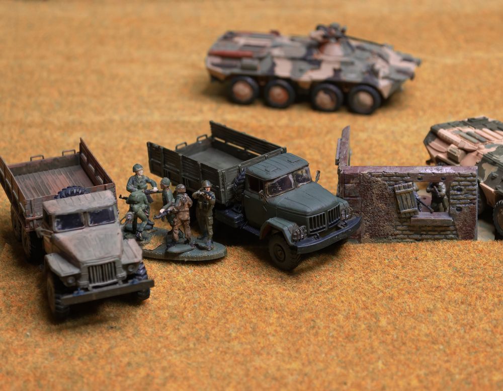 Miniature Military Vehicles And Soldiers On A Brown Surface — Midtown Hobbies In Lismore, NSW