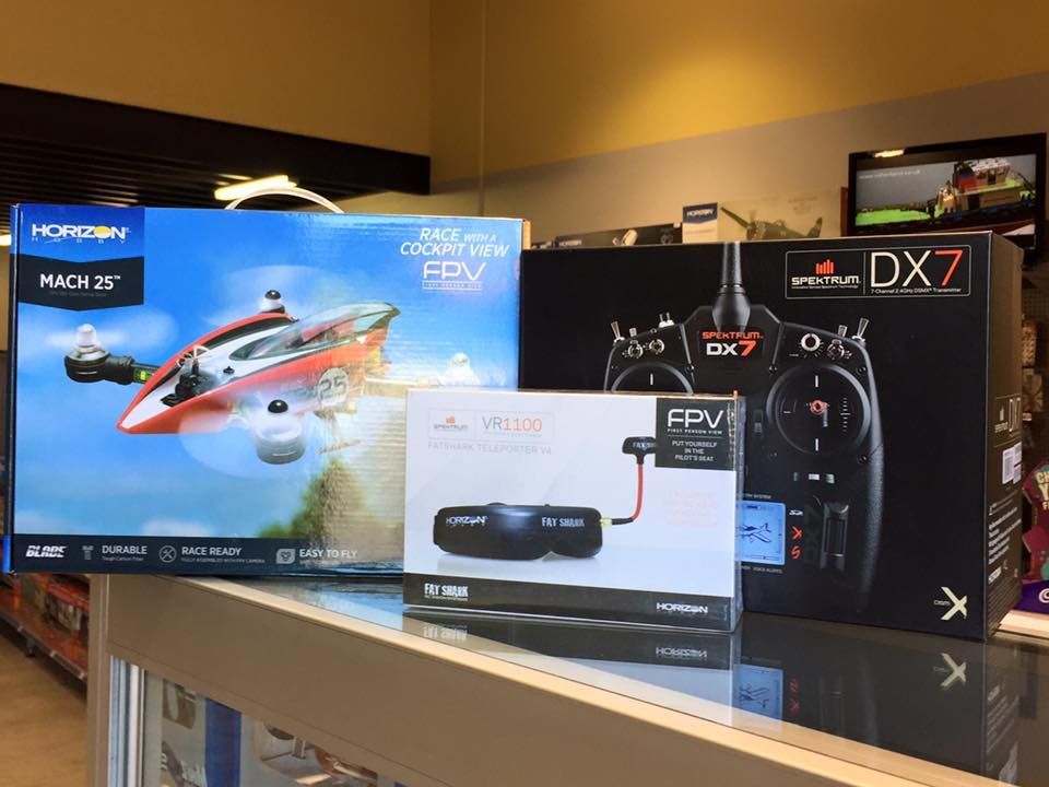 Boxes of RC Plane, Goggles, And Transmitter On A Store Counter — Midtown Hobbies In Lismore, NSW