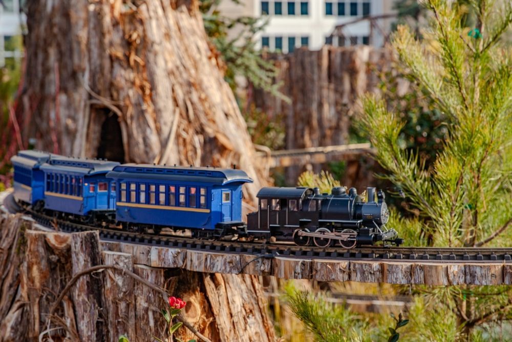 Model Train Traveling On A Track Over A Wooden Bridge — Midtown Hobbies In Lismore, NSW