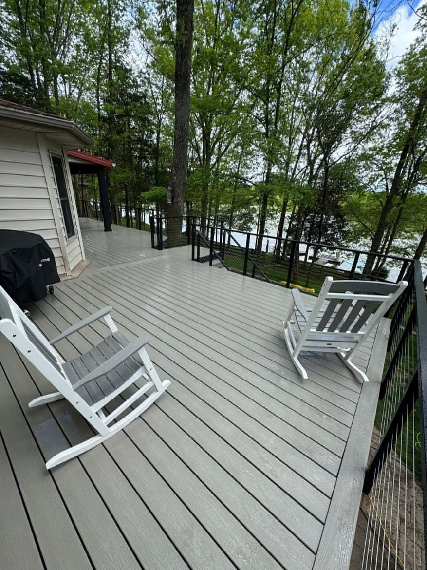 A brick house with a wooden deck and stairs