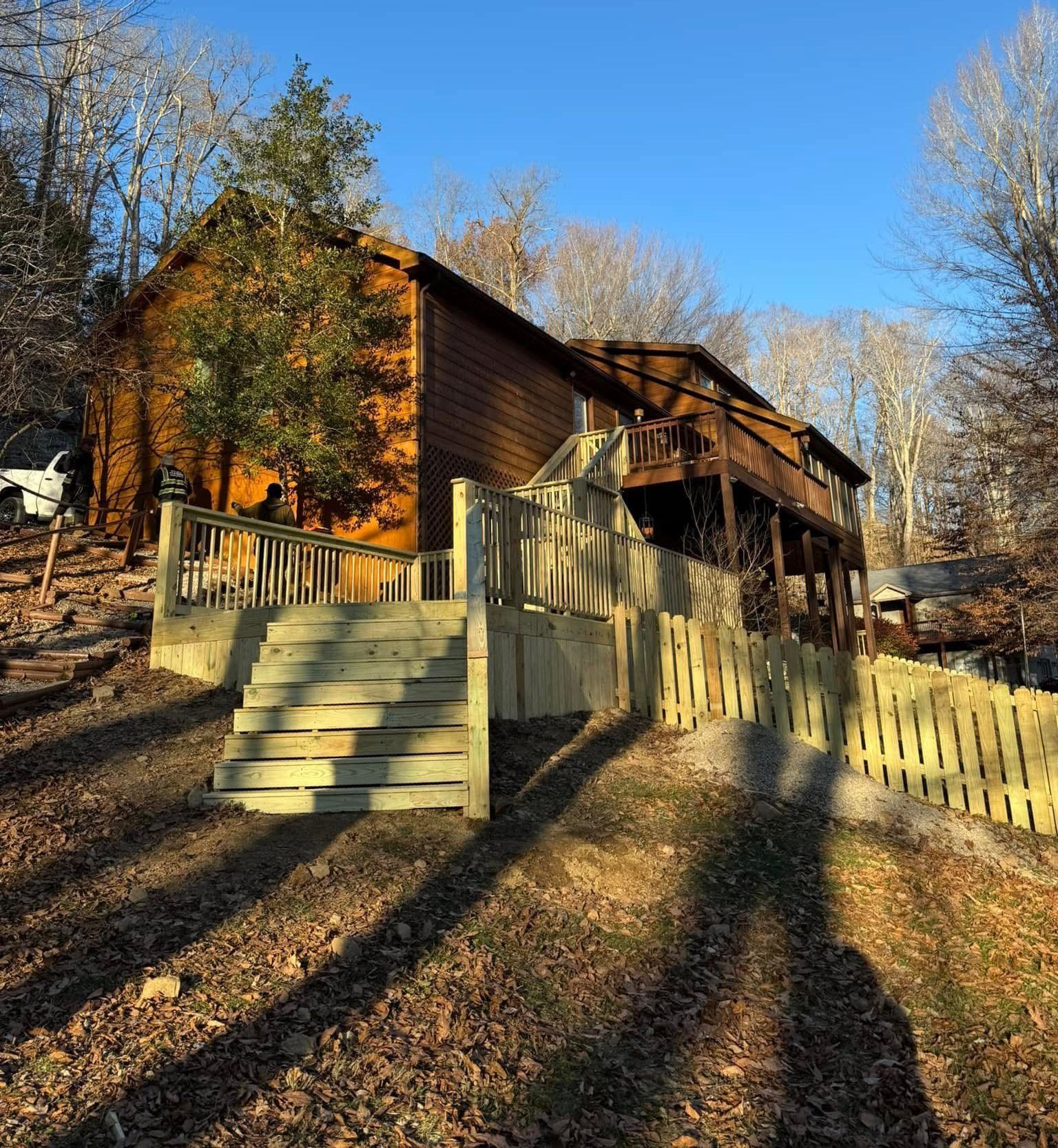 A wooden house with stairs leading up to it