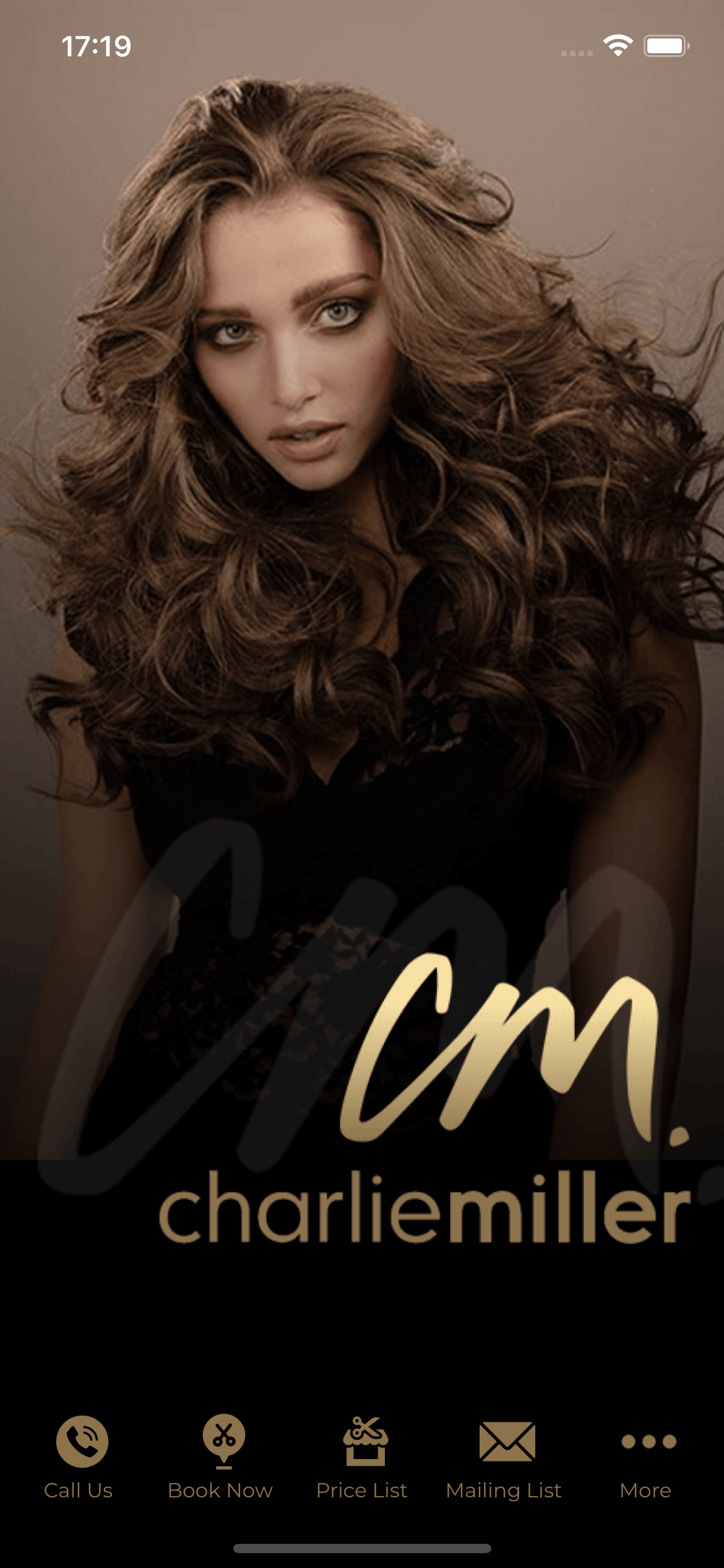 Woman with long, wavy brown hair and gold text 