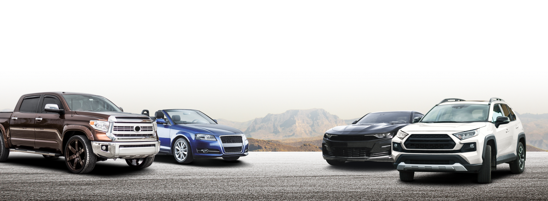 A group of cars are parked next to each other on the side of a road. | Friendly Auto Centers