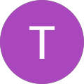 A purple circle with a white letter t inside of it.