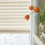 Window blinds in corner with flowers