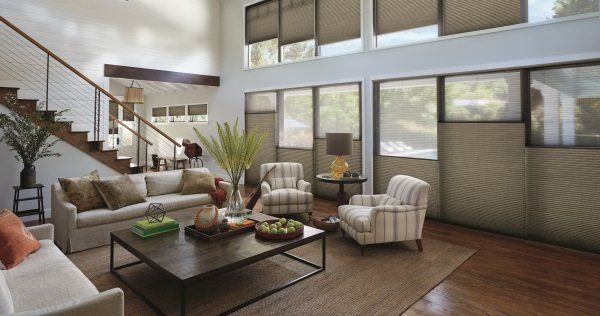 Floor to ceiling window treatments in living room