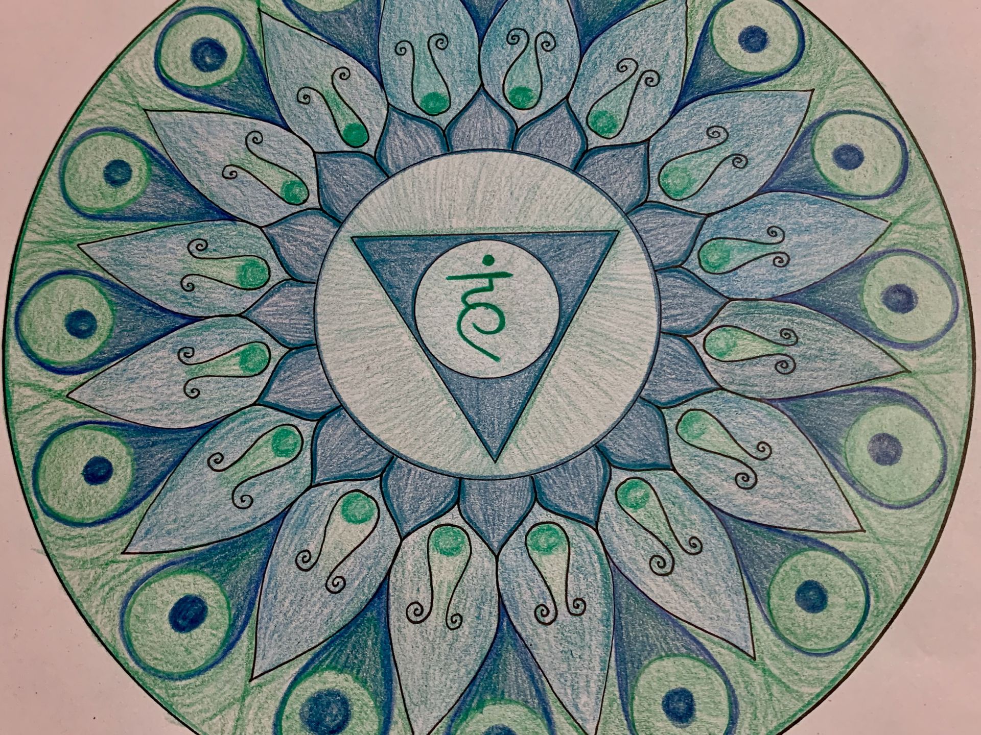 Blue and green mandala with a teal triangle, featuring Sanskrit symbol for vishudha chakra.