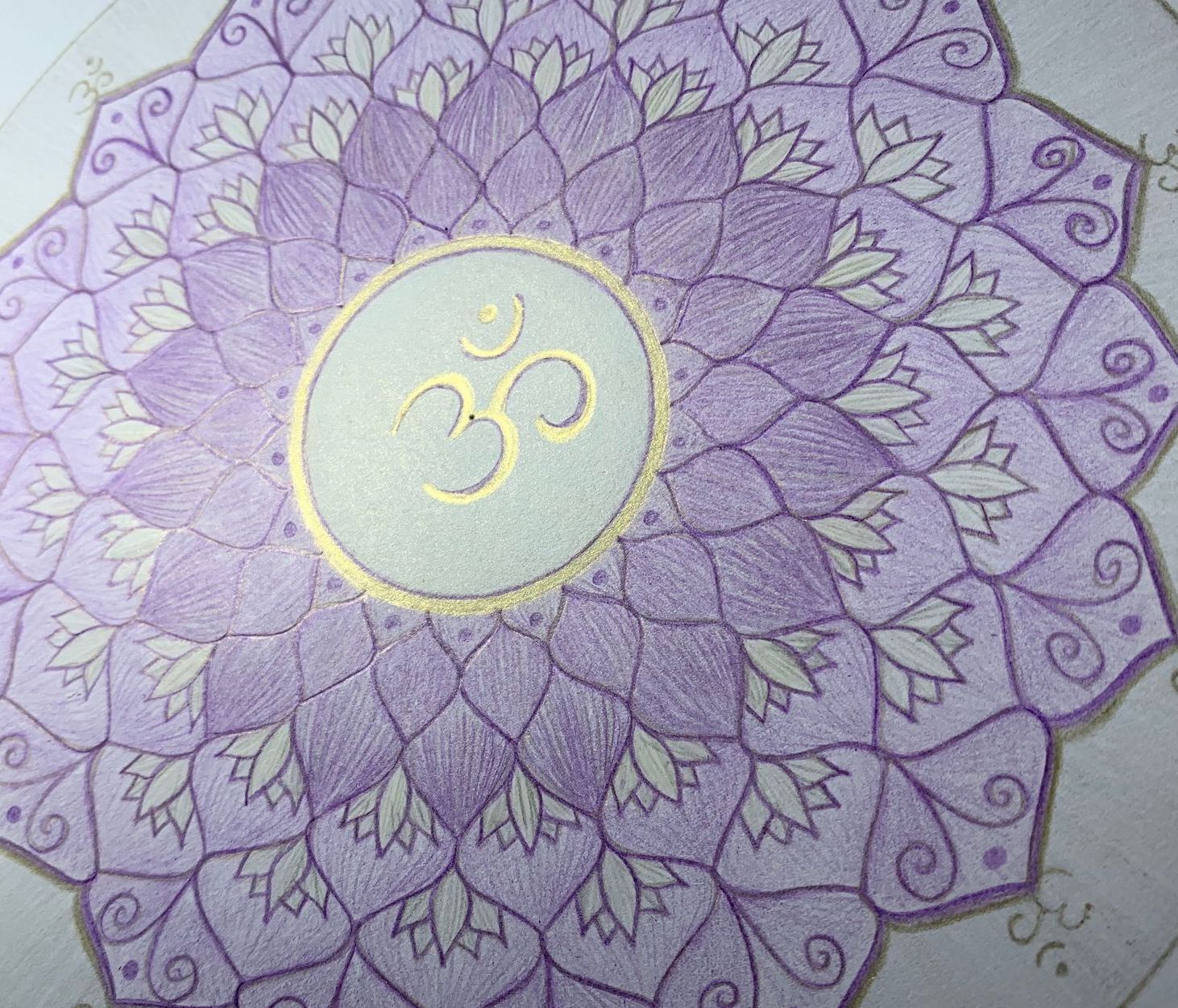 Purple mandala with a gold Om symbol in the center.