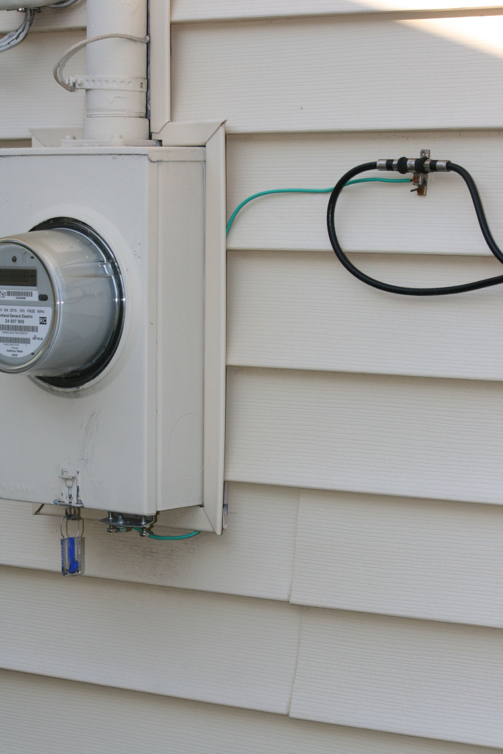 A meter is attached to the side of a house